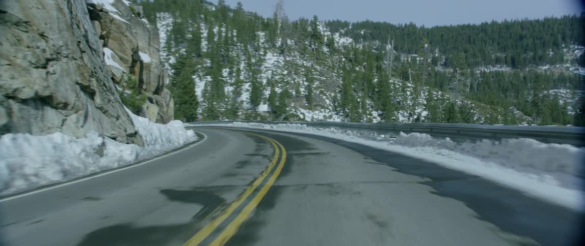A sharp, icy turn on a mountain road