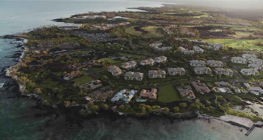 An aerial view of a neighborhood along the ocean