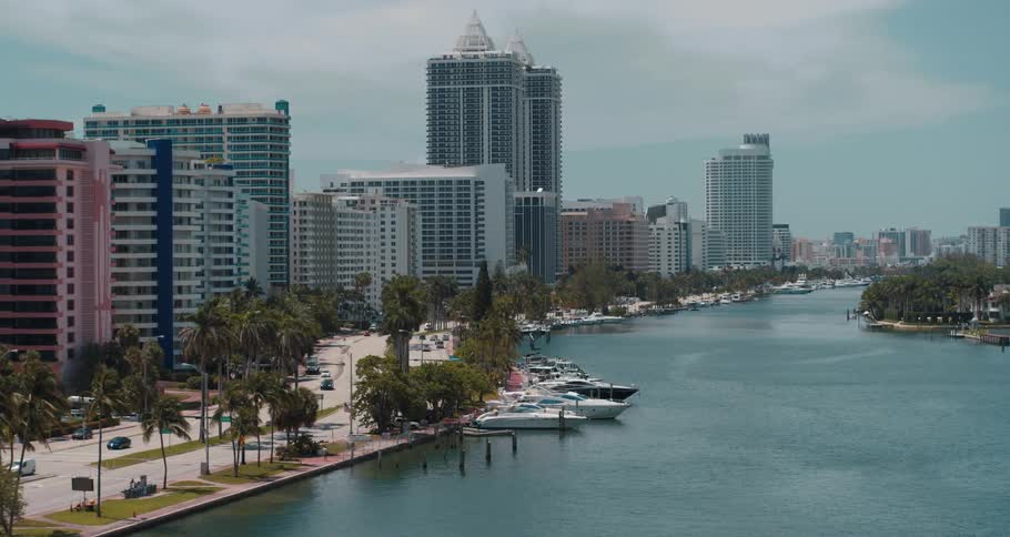 Boats line the water by the city
