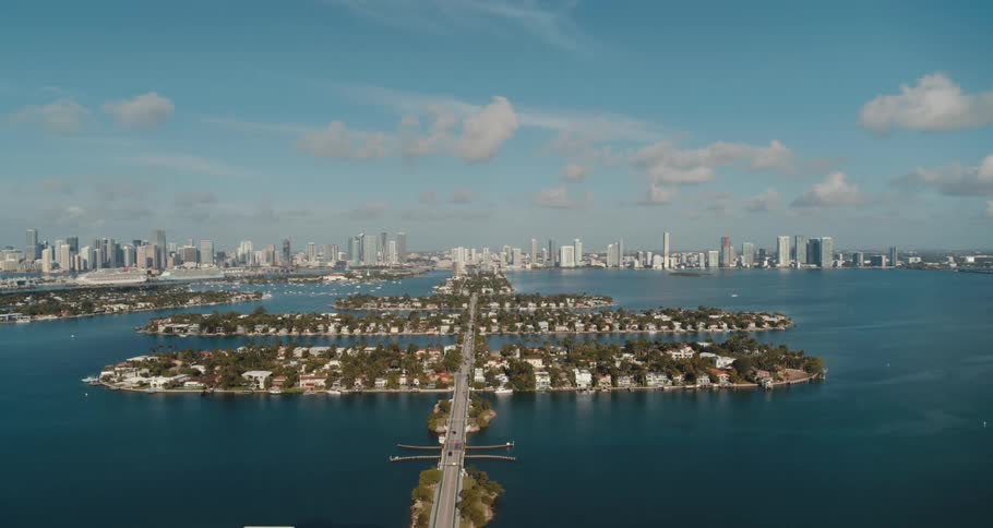 Aerial view of a highway running through island communities in miami