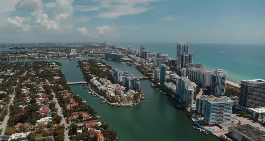 A island in a river splitting a metropolis on the coast during the day