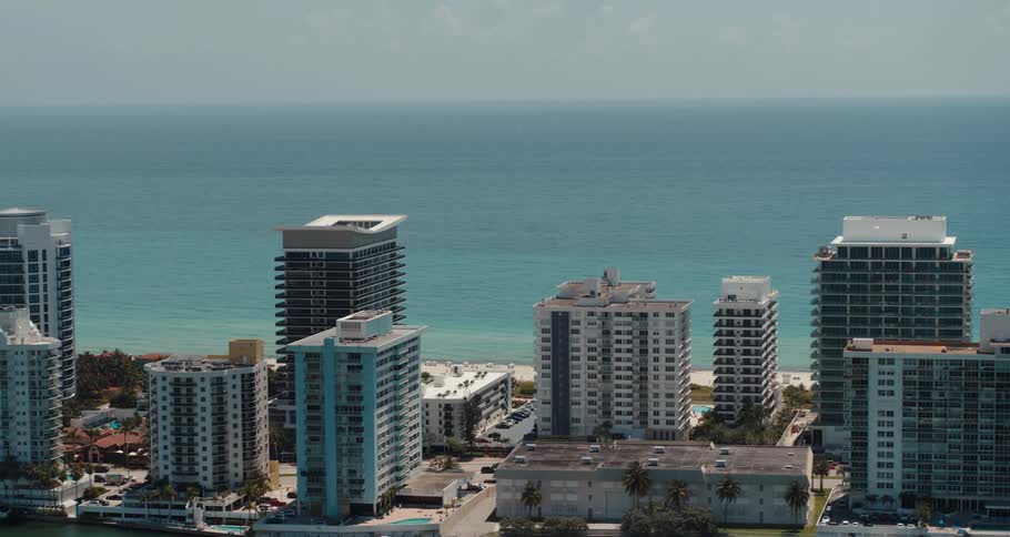 Tall buildings along the coast overlooking an ocean