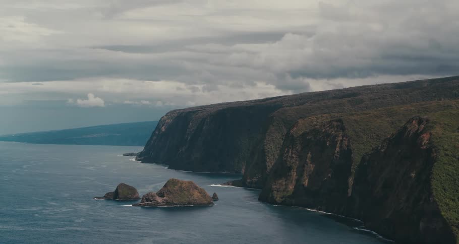An aerial view of a cliff along the ocean