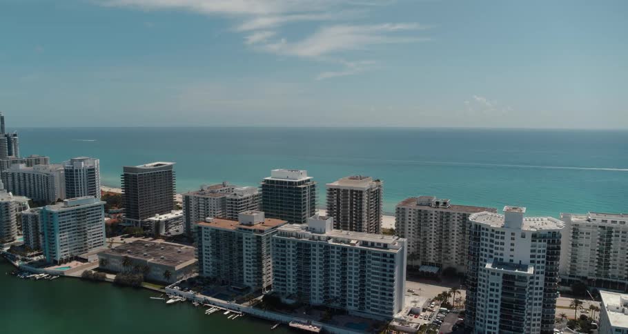 An aerial view of a city next to the ocean