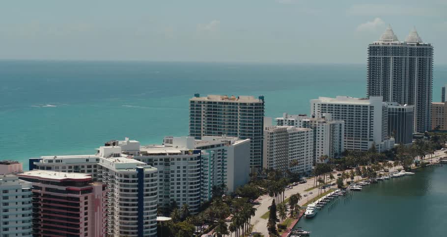 Aerial view of a downtown city near the coast is displayed