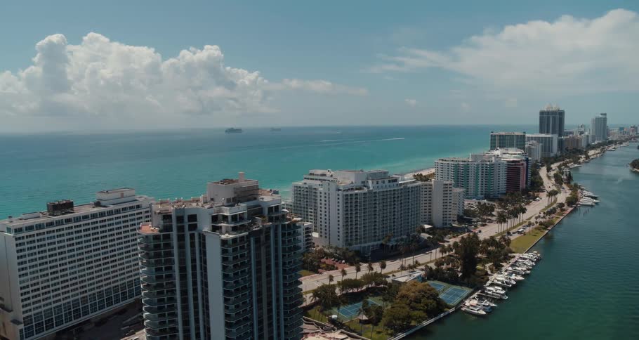 An aerial view of a city along the ocean