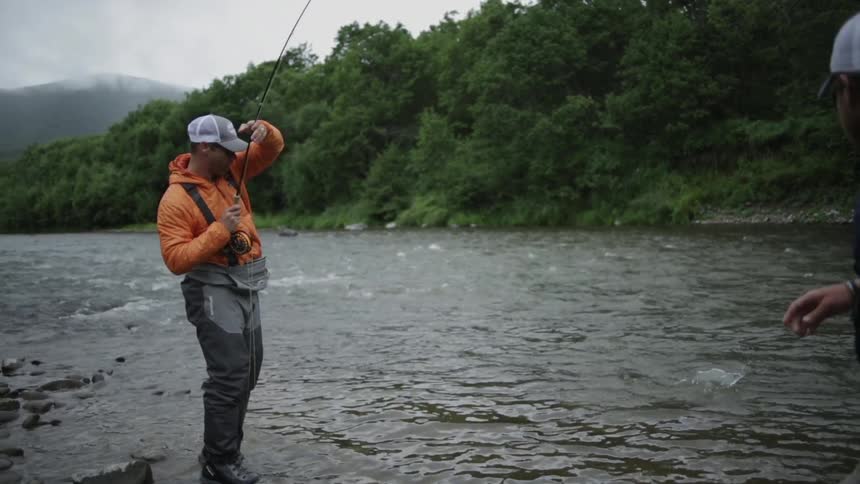 Two men fishing in a river