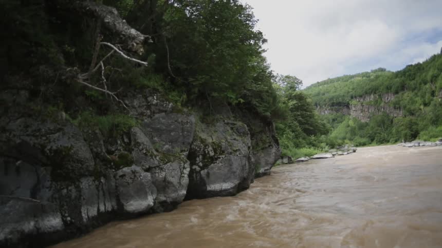 Water rushes and crashes against rocks