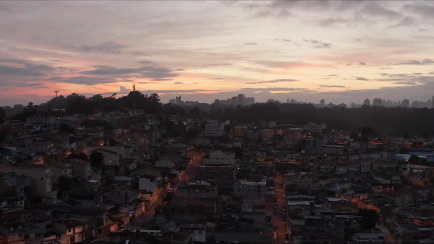 An aerial view of a city at dusk