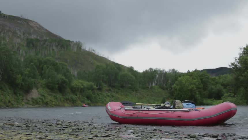 A raft is docked on the rocks