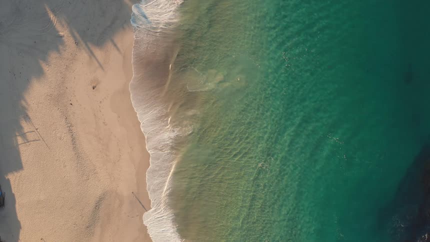 Aerial view of waves crashing on a beach