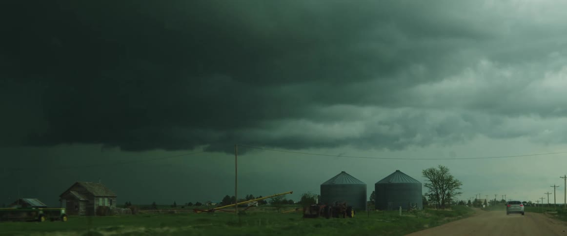 Dark storm cloud gathering over the farms on the countryside