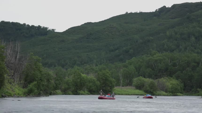 Two rafts move in the rough water