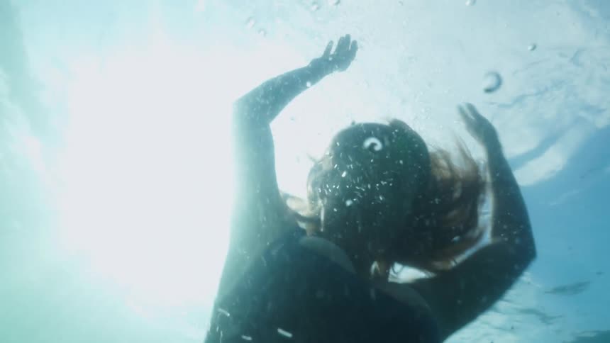 A woman swimming in a pool