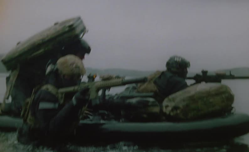 Soldiers get off the raft and travel forward