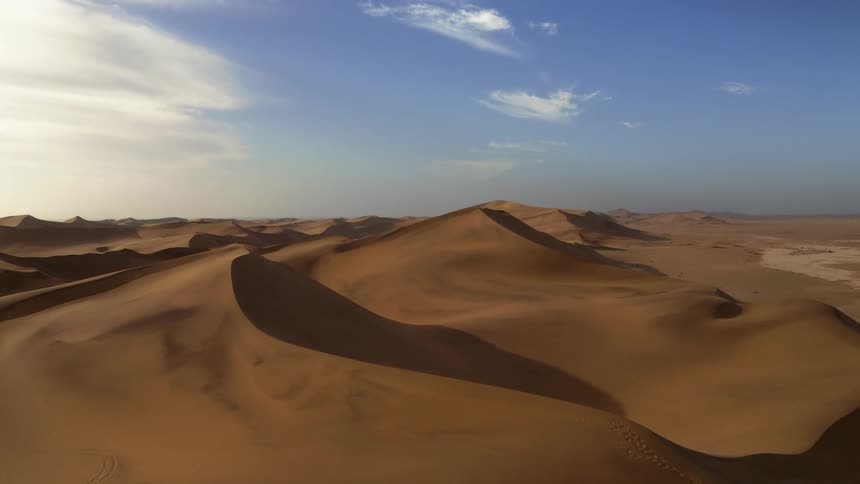 An aerial view of a desert landscape during the day