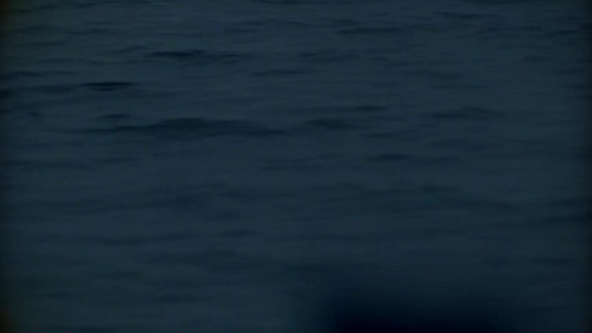 A vessel on water with ripples