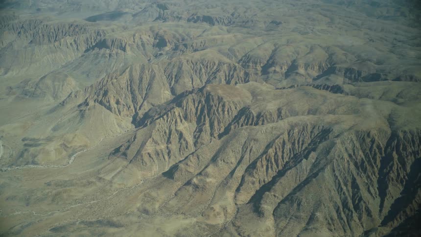 Fog covers the mountains below