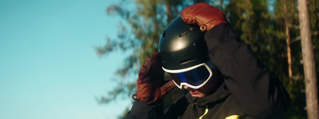 A person is putting on their ski equipment