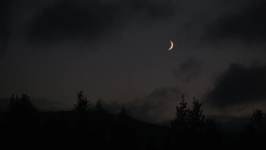The moon in a cloudy sky
