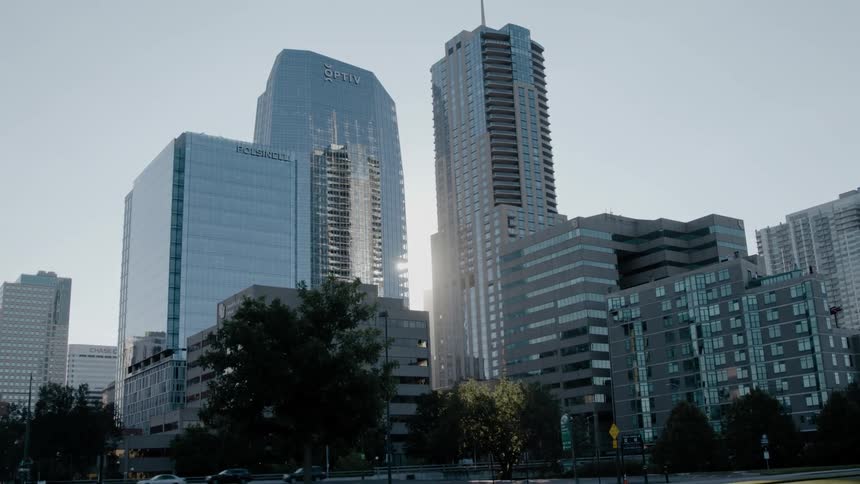 Cityscaoe of tall glass buildings in the city skyline in the morning