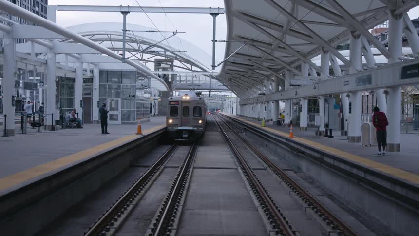 People waiting for a train at a station