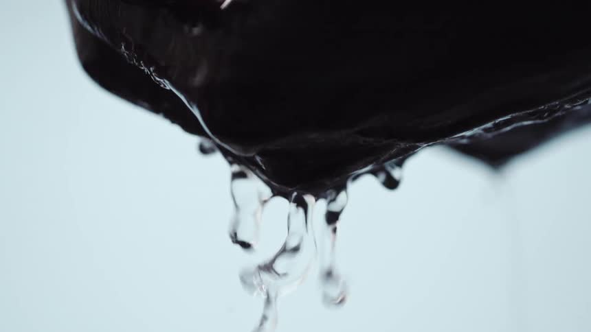 A view of a person picking up water with their hands