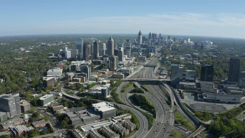 Cars travel on the roads through the large city