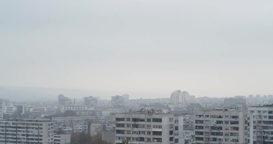 Dilapidated apartment buildings fill the skyline in a developing country