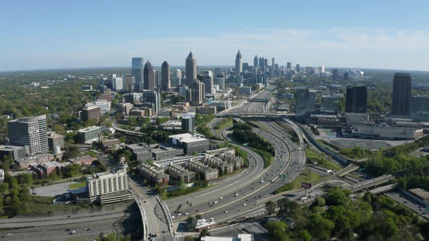 A freeway running through a metropolis on a sunny day