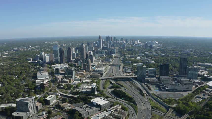 An aerial view of a city with tall buildings