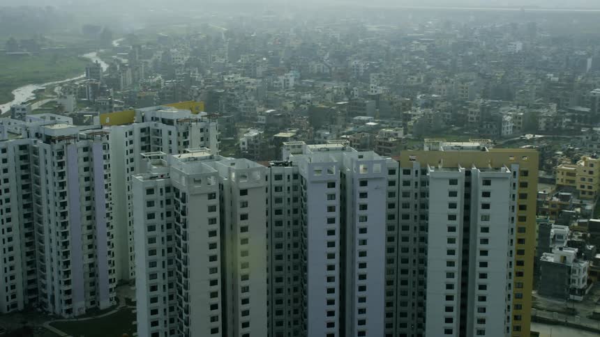 Tall apartment buildings sit in the center of the city