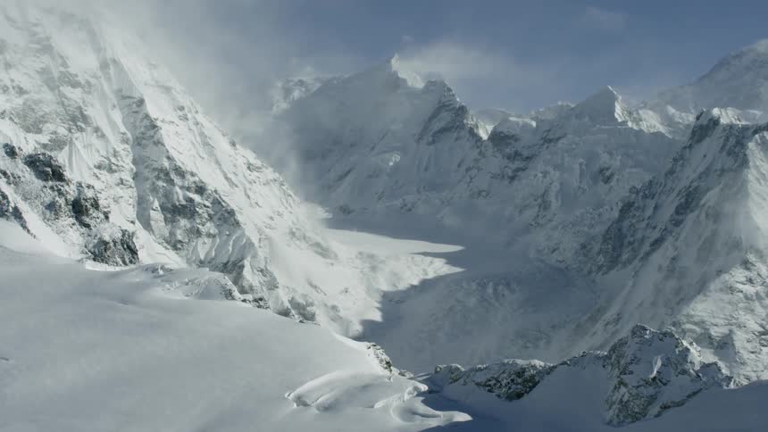 Flying over snow covered mountains