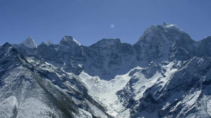Snow and ice cover the tall mountains