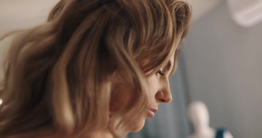 A woman is looking around almost smiling