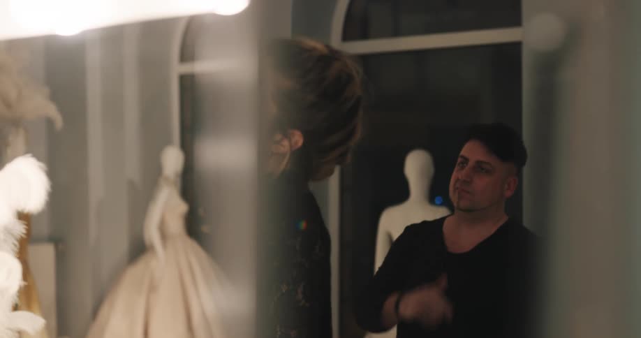 A view of a woman putting makeup onto another person
