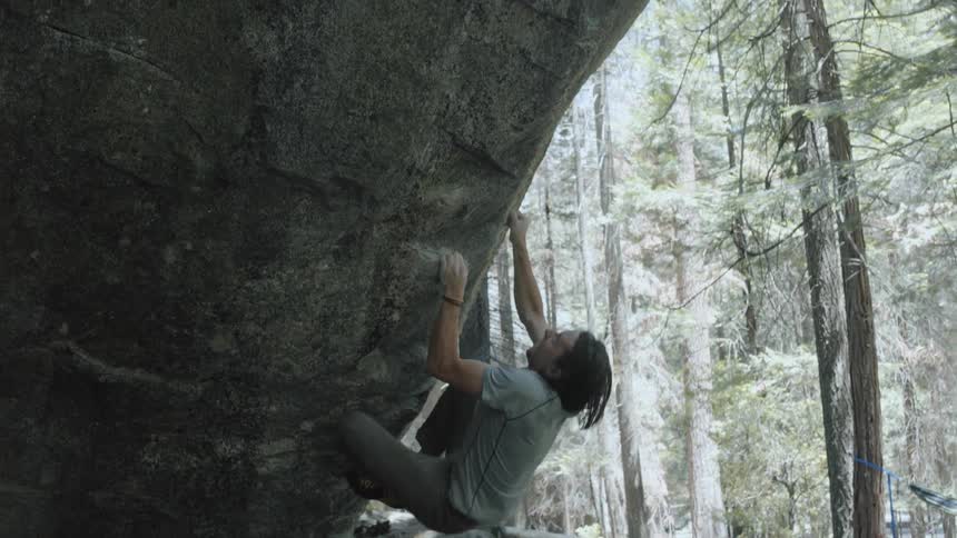 A man is rock climbing, but he falls
