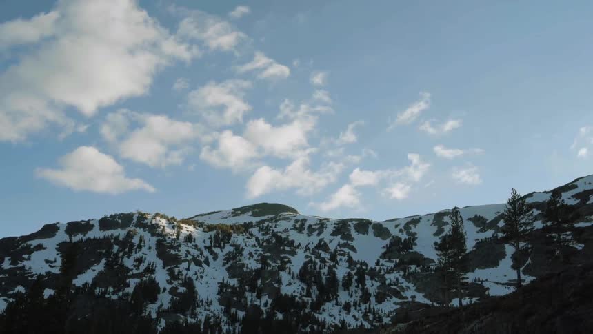 A snowy mountain during the day