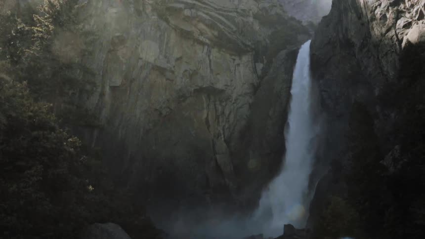 Water is pouring down a high waterfall