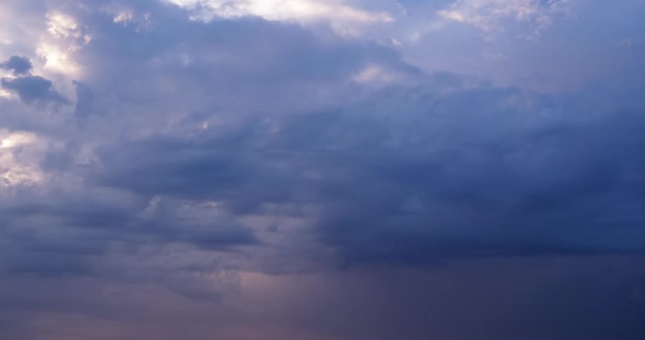 Clouds float in the blue sky