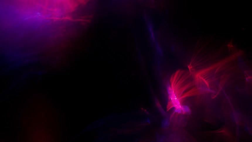 Shimmering moving red blue purple lights on a black background