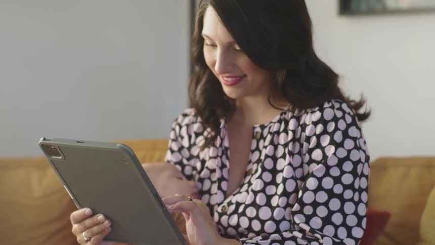 A mother and baby using a tablet