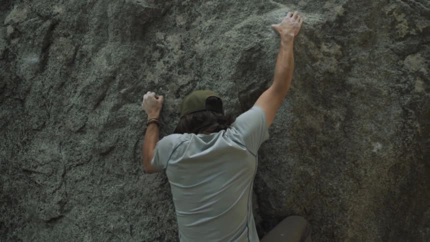A man climbs a rock face