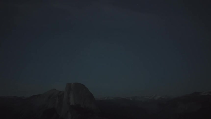 A snowy mountain at night