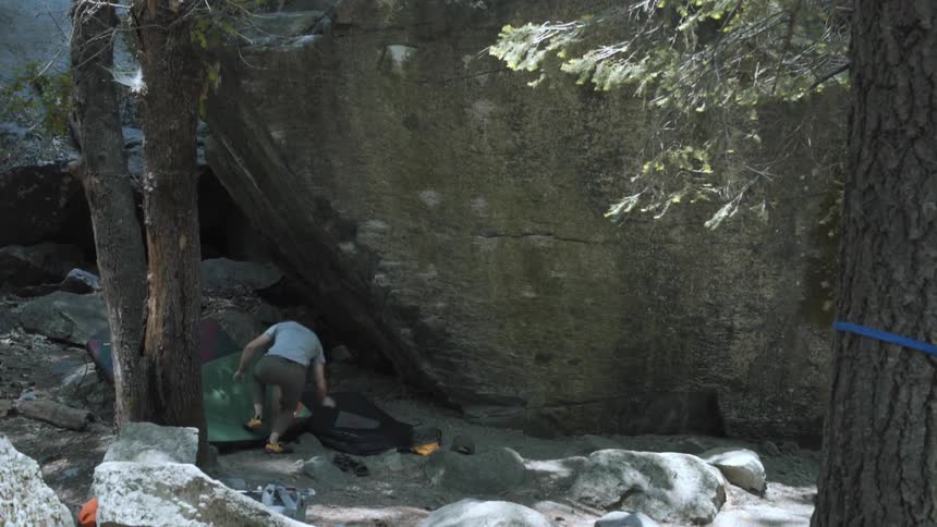 A man tries to rock climb and falls off
