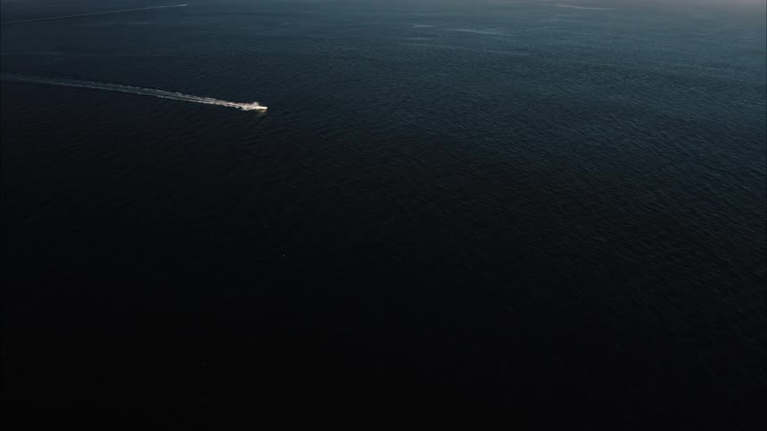 A boat traveling in a body of water
