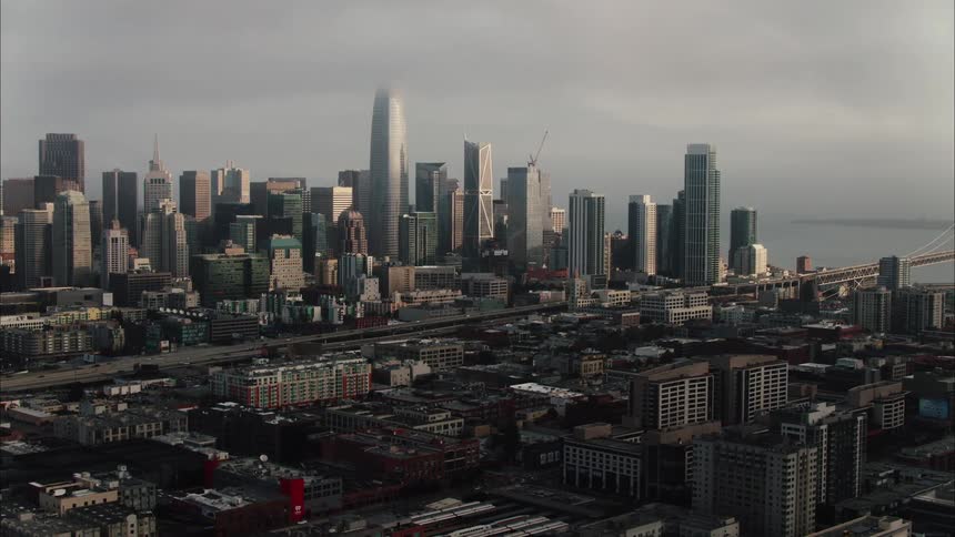 An aerial view of a city with large buildings