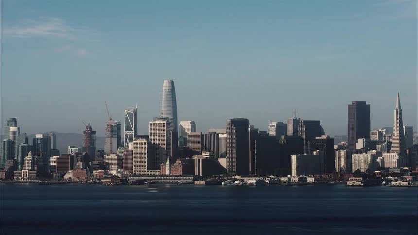 A city sits on the waterfront of a river