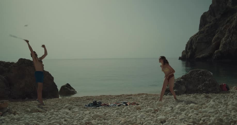 Two people playing at the beach