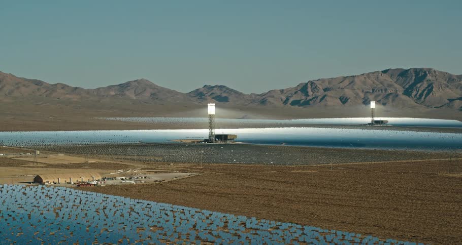 The field is filled with solar panels